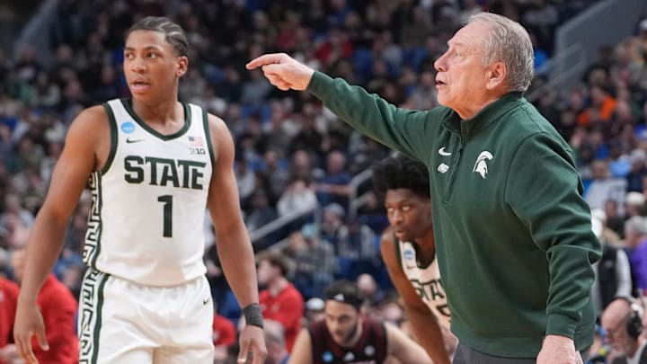 Michigan State Spartans guard Jeremy Fears Jr. (1) exchanges words with head coach Tom Izzo