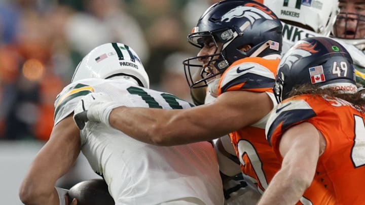 Green Bay Packers quarterback Jordan Love (10) is sacked by Denver Broncos linebacker Jonah Elliss (52). Green Bay Packers quarterback Jordan Love (10) is sacked by Denver Broncos linebacker Jonah Elliss (52).