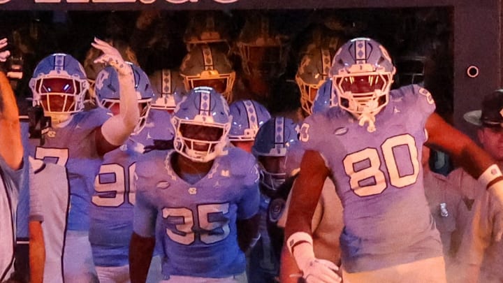 UNC entering Kenan Stadium through smoke before its game against TCU on Sept. 1, 2025. UNC entering Kenan Stadium through smoke before its game against TCU on Sept. 1, 2025.