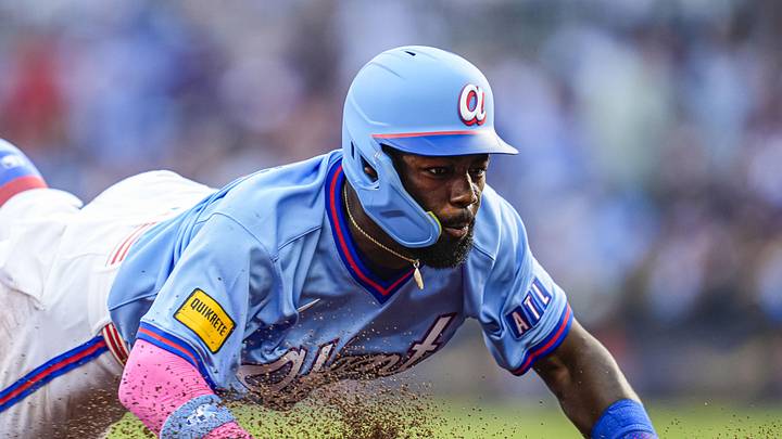 May 23, 2026; Cumberland, Georgia, USA; Atlanta Braves center fielder Michael Harris II (23) dives into third base against the Washington Nationals during the seventh inning at Truist Park. Mandatory Credit: Dale Zanine-Imagn Images