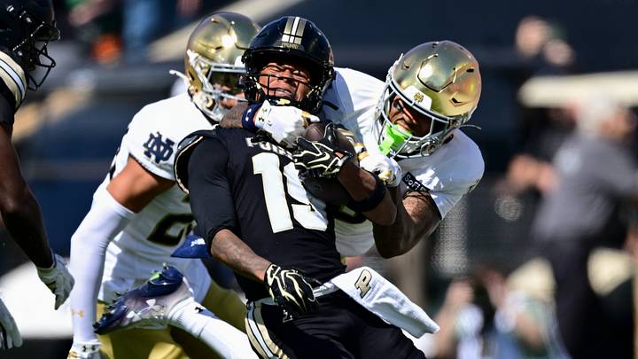 Purdue Boilermakers wide receiver Asaad Waseem (19) is pulled down.