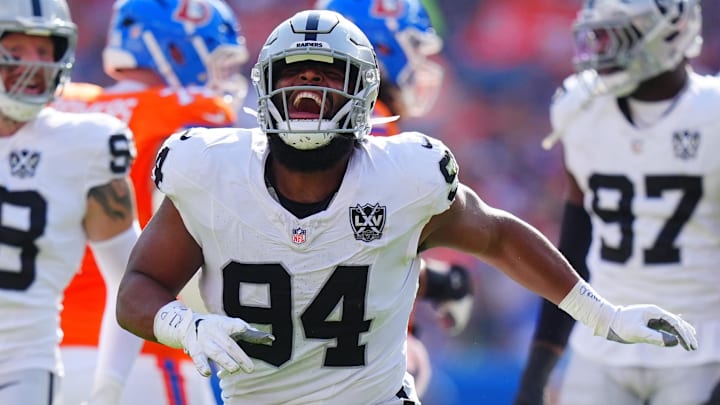 Oct 6, 2024; Denver, Colorado, USA; Las Vegas Raiders defensive tackle Christian Wilkins (94) celebrates his sack in the second quarter against the Denver Broncos at Empower Field at Mile High. Mandatory Credit: Ron Chenoy-Imagn Images Oct 6, 2024; Denver, Colorado, USA; Las Vegas Raiders defensive tackle Christian Wilkins (94) celebrates his sack in the second quarter against the Denver Broncos at Empower Field at Mile High. Mandatory Credit: Ron Chenoy-Imagn Images