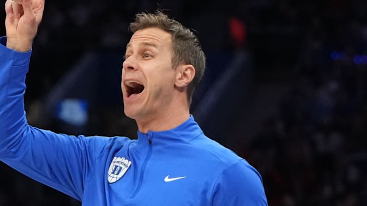 Mar 14, 2026; Charlotte, NC, USA; Duke Blue Devils head coach Jon Scheyer reacts in the first half during the men's ACC Conference Tournament Championship at Spectrum Center. Mandatory Credit: Bob Donnan-Imagn Images