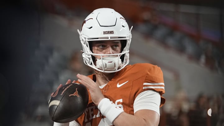 Nov 28, 2025; Austin, Texas, USA; Texas Longhorns quarterback Arch Manning warms up before a game against the Texas A&M Aggies at Darrell K Royal-Texas Memorial Stadium. Mandatory Credit: Scott Wachter-Imagn Images