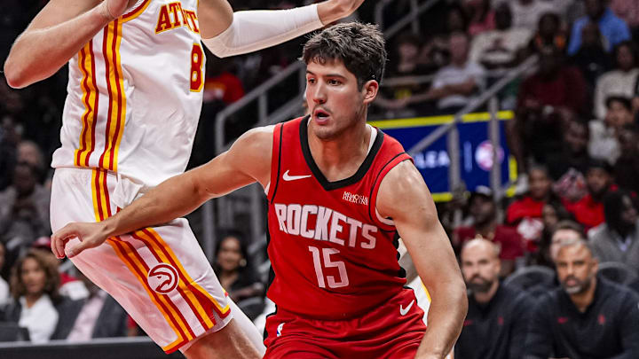 Oct 16, 2025; Atlanta, Georgia, USA; Houston Rockets guard Reed Sheppard (15) dribbles past Atlanta Hawks center Kristaps Porzingis (8) during the second half at State Farm Arena. Mandatory Credit: Dale Zanine-Imagn Images Oct 16, 2025; Atlanta, Georgia, USA; Houston Rockets guard Reed Sheppard (15) dribbles past Atlanta Hawks center Kristaps Porzingis (8) during the second half at State Farm Arena. Mandatory Credit: Dale Zanine-Imagn Images