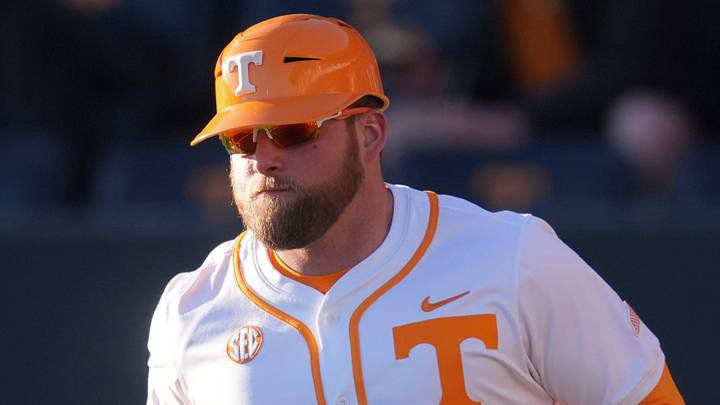Tennessee baseball coach Josh Elander runs out to his spot at third base during the NCAA college baseball game against Nicholls on Feb. 13, 2026, in Knoxville, Tennessee. Tennessee baseball coach Josh Elander runs out to his spot at third base during the NCAA college baseball game against Nicholls on Feb. 13, 2026, in Knoxville, Tennessee.