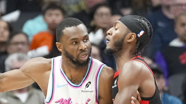 Miami Heat forward Andrew Wiggins dribbles the ball against Toronto Raptors guard Immanuel Quickley. Miami Heat forward Andrew Wiggins dribbles the ball against Toronto Raptors guard Immanuel Quickley.