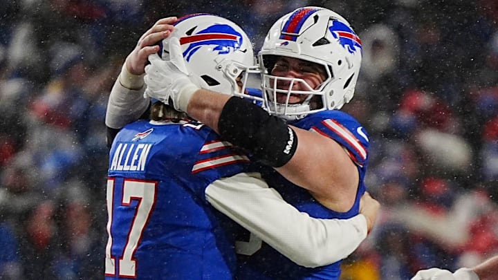 Buffalo Bills quarterback Josh Allen and Buffalo Bills guard Connor McGovern hug in the final minute of their divisional game against the Baltimore Ravens at Highmark Stadium in Orchard Park on Jan. 19, 2025. The Bills won 27-25.
