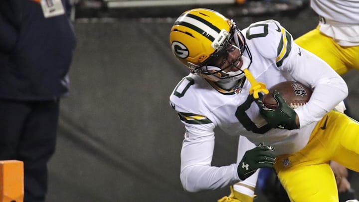 Green Bay Packers receiver Matthew Golden tumbles into the end zone for a touchdown against the Bears in the playoffs.
