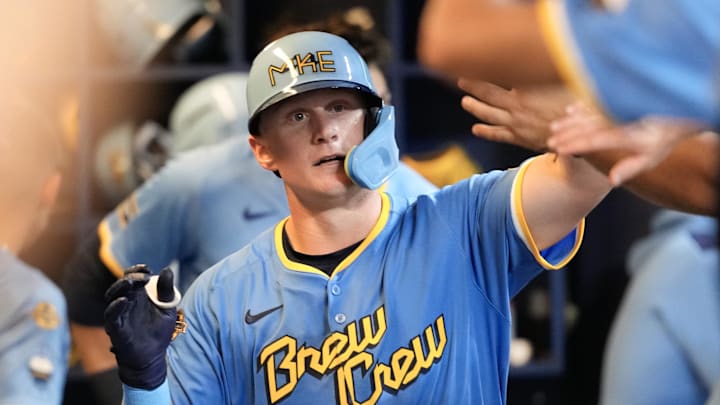 Milwaukee, Wisconsin, USA; Milwaukee Brewers first baseman Andrew Vaughn (28) high fives teammates in the dugout after hitting a home run during the seventh inning against the Washington Nationals at American Family Field. Milwaukee, Wisconsin, USA; Milwaukee Brewers first baseman Andrew Vaughn (28) high fives teammates in the dugout after hitting a home run during the seventh inning against the Washington Nationals at American Family Field.