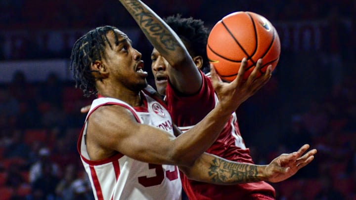 Oklahoma forward Derrion Reid attempts a layup against Arkansas.