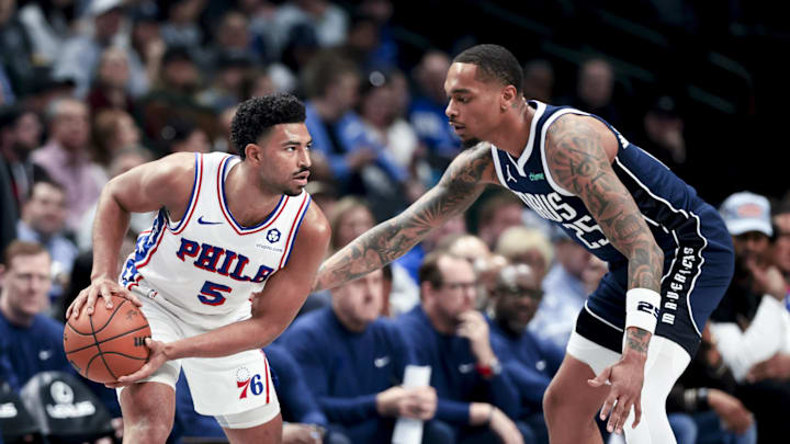 Mar 16, 2025; Dallas, Texas, USA;  Philadelphia 76ers guard Quentin Grimes (5) looks to score as Dallas Mavericks forward P.J. Washington (25) defends during the first half at American Airlines Center. Mandatory Credit: Kevin Jairaj-Imagn Images