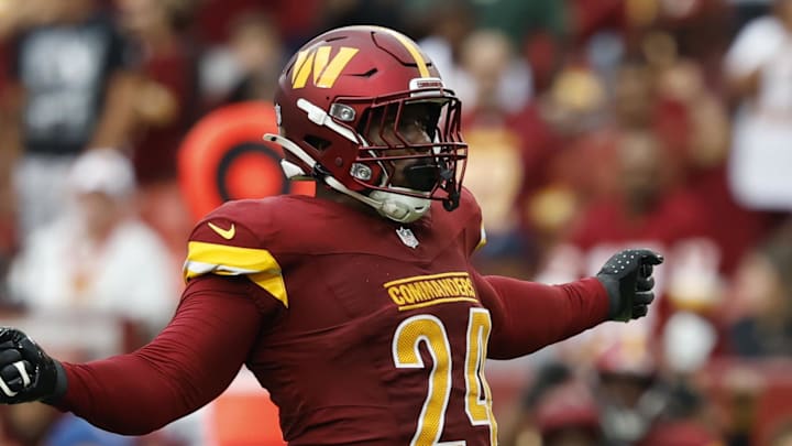 Sep 21, 2025; Landover, Maryland, USA; Washington Commanders outside linebacker Von Miller (24) celebrates with Commanders linebacker Frankie Luvu (4) after recording a sack against the Las Vegas Raiders during the third quarter at Northwest Stadium. Mandatory Credit: Geoff Burke-Imagn Images