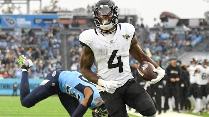 Dec 8, 2024; Nashville, Tennessee, USA; Jacksonville Jaguars running back Tank Bigsby (4) runs the ball and scores a touchdown against the Tennessee Titans during the second half at Nissan Stadium. Mandatory Credit: Steve Roberts-Imagn Images Dec 8, 2024; Nashville, Tennessee, USA; Jacksonville Jaguars running back Tank Bigsby (4) runs the ball and scores a touchdown against the Tennessee Titans during the second half at Nissan Stadium. Mandatory Credit: Steve Roberts-Imagn Images
