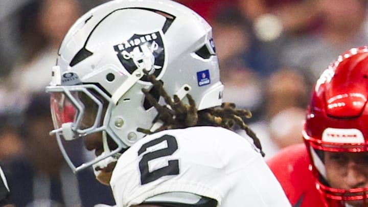 Dec 21, 2025; Houston, Texas, USA; Las Vegas Raiders running back Ashton Jeanty (2) rushes against the Houston Texans during the second quarter at NRG Stadium. Mandatory Credit: Thomas Shea-Imagn Images