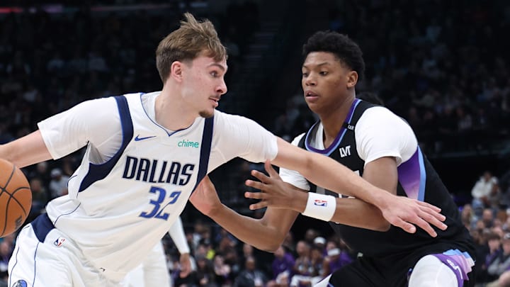 Dec 15, 2025; Salt Lake City, Utah, USA; Dallas Mavericks forward Cooper Flagg (32) drives to the basket against Utah Jazz guard Ace Bailey (19) during the second quarter at Delta Center. Mandatory Credit: Rob Gray-Imagn Images