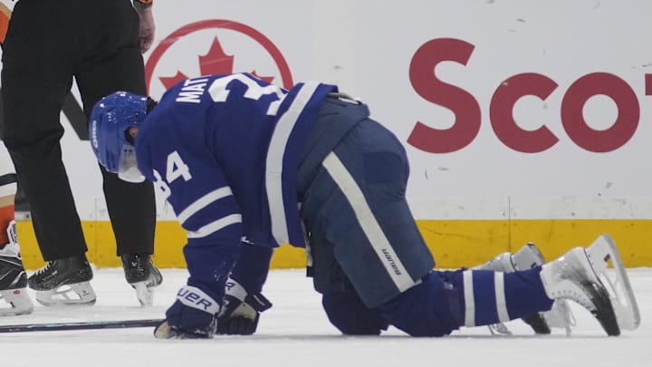 Mar 12, 2026; Toronto, Ontario, CAN; Anaheim Ducks defenseman Radko Gudas (7) looks at an injured Toronto Maple Leafs forward Auston Matthews (34) after he delivered a knee on knee hit during the second period at Scotiabank Arena. Mandatory Credit: John E. Sokolowski-Imagn Images