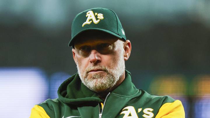 Apr 22, 2026; Seattle, Washington, USA; Athletics manager Mark Kotsay (7) talks with staff in the dugout following a batted ball that was trapped in the jersey of Seattle Mariners starting pitcher Logan Gilbert (36, not pictured) during the first inning at T-Mobile Park. The play was ruled a hit. Mandatory Credit: Joe Nicholson-Imagn Images Apr 22, 2026; Seattle, Washington, USA; Athletics manager Mark Kotsay (7) talks with staff in the dugout following a batted ball that was trapped in the jersey of Seattle Mariners starting pitcher Logan Gilbert (36, not pictured) during the first inning at T-Mobile Park. The play was ruled a hit. Mandatory Credit: Joe Nicholson-Imagn Images