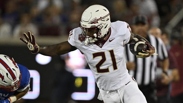Sep 28, 2024; Dallas, Texas, USA; Southern Methodist Mustangs safety Jonathan McGill (2) and Florida State Seminoles wide receiver Darion Williamson (21) in action during the game between the Southern Methodist Mustangs and the Florida State Seminoles at Gerald J. Ford Stadium. Mandatory Credit: Jerome Miron-Imagn Images