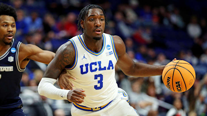 Mar 20, 2025; Lexington, KY, USA; UCLA Bruins guard Eric Dailey Jr. (3) drives to the basket against Utah State Aggies guard Dexter Akanno (7) during the second half in the first round of the NCAA Tournament at Rupp Arena. Mandatory Credit: Jordan Prather-Imagn Images Mar 20, 2025; Lexington, KY, USA; UCLA Bruins guard Eric Dailey Jr. (3) drives to the basket against Utah State Aggies guard Dexter Akanno (7) during the second half in the first round of the NCAA Tournament at Rupp Arena. Mandatory Credit: Jordan Prather-Imagn Images