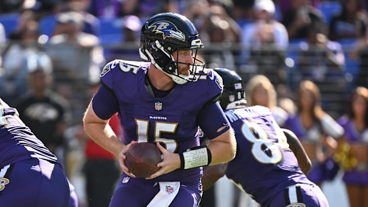 Oct 5, 2025; Baltimore, Maryland, USA; Baltimore Ravens quarterback Cooper Rush (15) looks back to pass during the third quarter against the Houston Texans at M&T Bank Stadium. Mandatory Credit: Rafael Suanes-Imagn Images