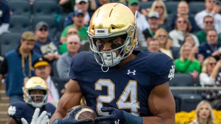 Oct 5, 2019; South Bend, IN, USA; Notre Dame Fighting Irish tight end Tommy Tremble (24) catches a pass for a touchdown as Bowling Green Falcons cornerback Caleb Biggers (2) defends in the first quarter at Notre Dame Stadium. 