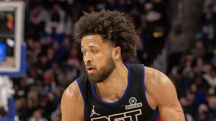 Houston Rockets guard Amen Thompson defends against Detroit Pistons guard Cade Cunningham.