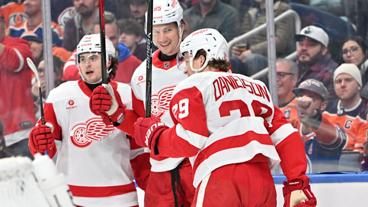 Dec 11, 2025; Edmonton, Alberta, CAN; Detroit Red Wings  center Marco Kasper (92), left winger Elmer Soderblom (85) and center Nate Danielson (29) celebrate a goal on Edmonton Oilers goalie Stuart Skinner (74) during the second period at Rogers Place. Mandatory Credit: Walter Tychnowicz-Imagn Images