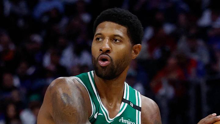 Oct 20, 2026; Detroit, Michigan, USA;  Boston Celtics forward Paul George (13) is defended by Detroit Pistons forward-center John Collins (20) in the second half at Little Caesars Arena.  Mandatory Credit: Rick Osentoski-Imagn Images