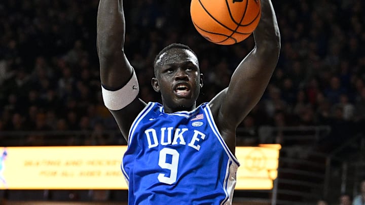 Jan 18, 2025; Chestnut Hill, Massachusetts, USA; Duke Blue Devils center Khaman Maluach (9) dunks the ball against the Boston College Eagles during the first half at Conte Forum. Mandatory Credit: Eric Canha-Imagn Images