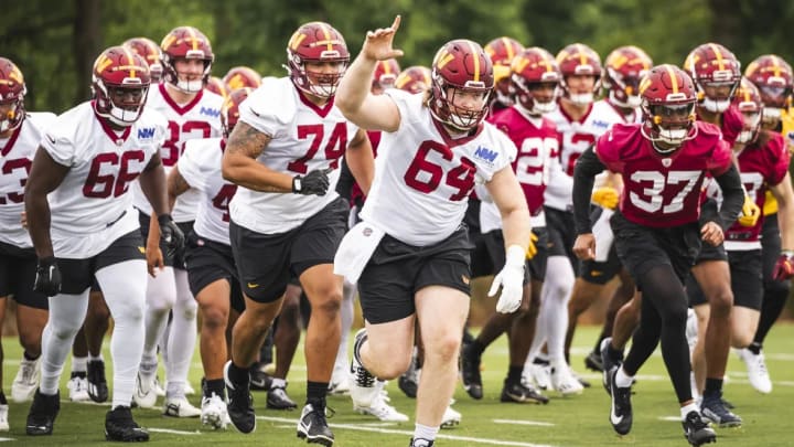 Washington Commanders rookies take the field for rookie minicamp in Ashburn, Virginia.