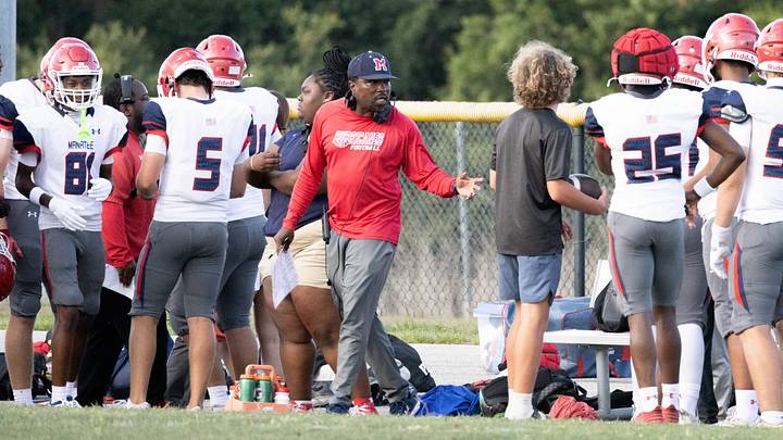 Manatee head coach Jacquez Green talks with players on the Hurricanes’ sideline. Manatee head coach Jacquez Green talks with players on the Hurricanes’ sideline.