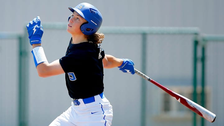 Ethan Holliday hits during a Stillwater High School baseball game in Stillwater, Okla., Saturday, April 30, 2022.