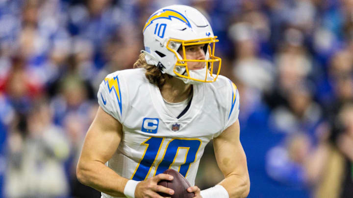 Dec 26, 2022; Indianapolis, Indiana, USA; Los Angeles Chargers quarterback Justin Herbert (10) drops back to pass the ball in the first half against the Indianapolis Colts at Lucas Oil Stadium. Mandatory Credit: Trevor Ruszkowski-Imagn Images