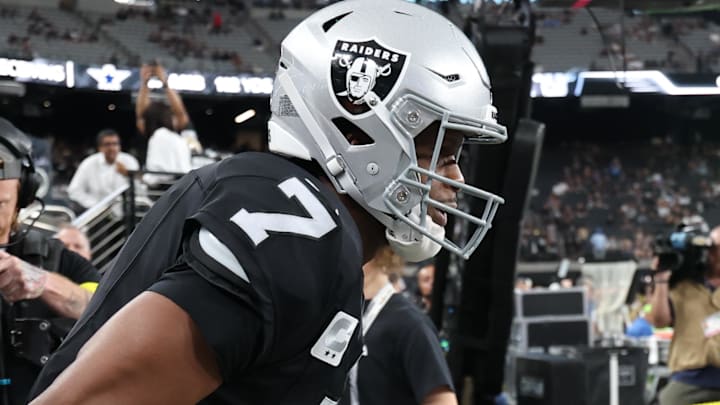 Sep 15, 2025; Paradise, Nevada, USA; Las Vegas Raiders quarterback Geno Smith (7) takes the field for warms ups before the game against the Los Angeles Chargers at Allegiant Stadium. Mandatory Credit: Kiyoshi Mio-Imagn Images