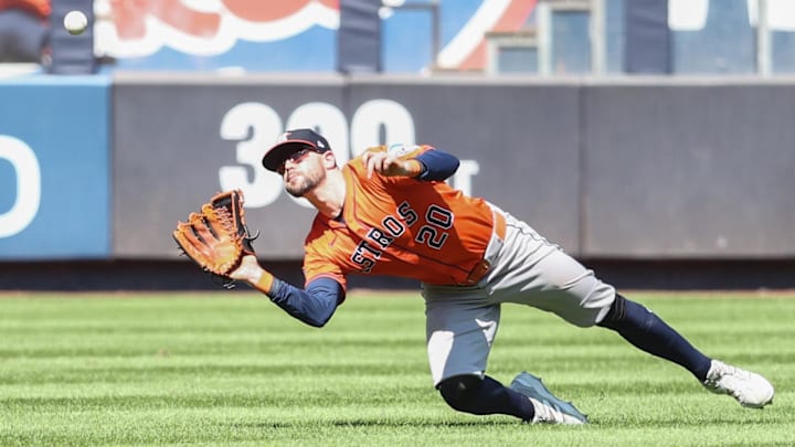 Houston Astros center fielder Chas McCormick (20) makes a diving catch in the fourth inning against the New York Yankees at Yankee Stadium. 