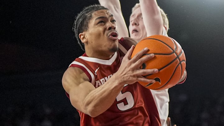 Arkansas Razorbacks guard Darius Acuff Jr. (5) drives to the basket against Georgia Bulldogs guard Blue Cain (0) during the second half at Stegeman Coliseum in Athens, Ga.