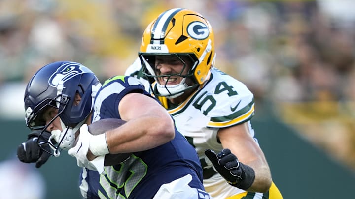Green Bay Packers linebacker Kristian Welch (54) tackles Seattle Seahawks tight end Marshall Lang (49).