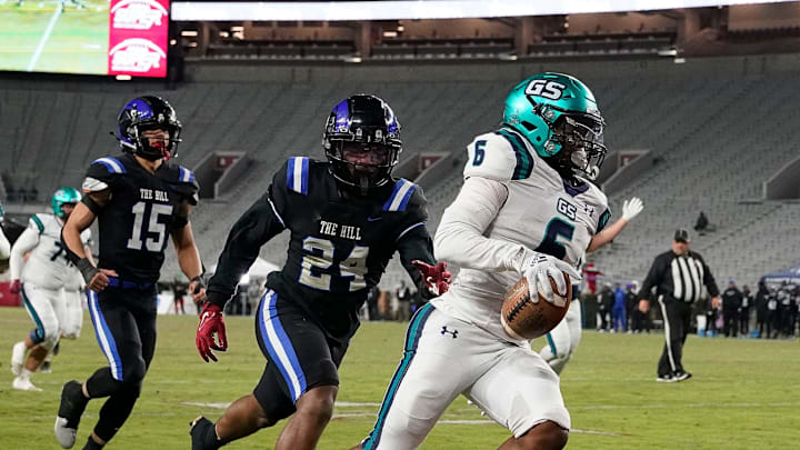 Gulf Shores running back Kolin Wilson scores as he is pursued by Ramsay   s Jaiden Humes (24) during