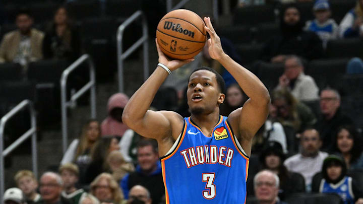 Oct 14, 2025; Milwaukee, Wisconsin, USA; Oklahoma City Thunder guard Chris Youngblood (3) hits a 3-point shot against the Milwaukee Bucks during the second half at Fiserv Forum.