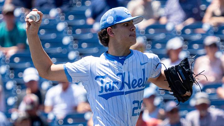 Jun 14, 2024; Omaha, NE, USA; North Carolina Tar Heels starting pitcher Jason DeCaro (29) throws the opening pitch against the Virginia Cavaliers at Charles Schwab Filed Omaha. Mandatory Credit: Dylan Widger-Imagn Images