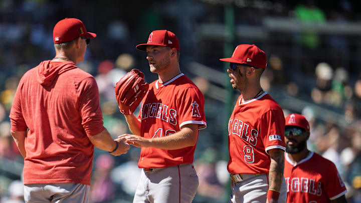 Angels pitcher Reid Detmers (48) is relieved by  interim manager Ray Montgomery (81) during the eighth inning at Sutter Health Park on Aug. 17.