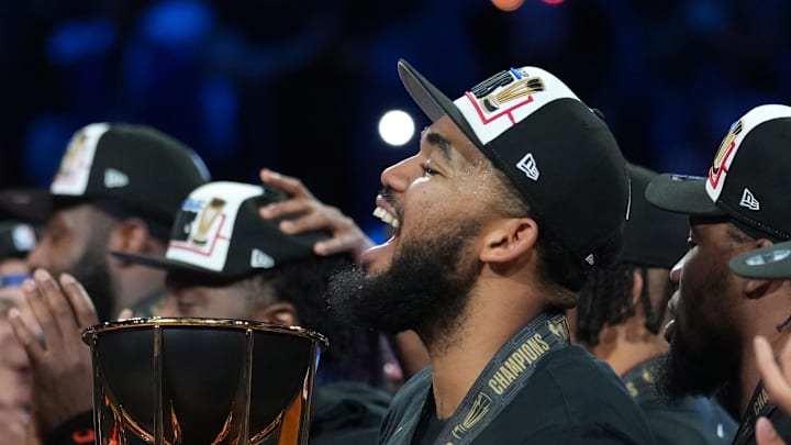 New York Knicks center Karl-Anthony Towns holds the the Emirates NBA Cup trophy after victory over the San Antonio Spurs