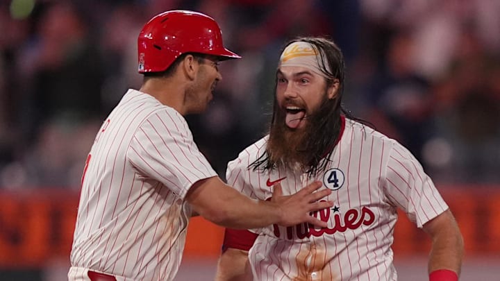 Jun 9, 2025; Philadelphia, Pennsylvania, USA; Philadelphia Phillies outfielder Brandon Marsh (16) celebrates with teammates after hitting an RBI single against the Chicago Cubs in the eleventh inning at Citizens Bank Park