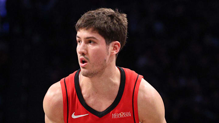 Feb 4, 2025; Brooklyn, New York, USA; Houston Rockets guard Reed Sheppard (15) dribbles as Brooklyn Nets guard Reece Beekman (4) defends during the first half at Barclays Center. Mandatory Credit: Vincent Carchietta-Imagn Images