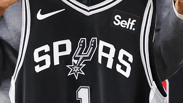 Jun 24, 2023; San Antonio, TX, USA; San Antonio Spurs draft pick Victor Wembanyama holds a jersey along with general manager Brian Wright during a press conference at AT&T Center.
