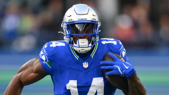 Oct 10, 2024; Seattle, Washington, USA; Seattle Seahawks wide receiver DK Metcalf (14) carries the ball after a catch during the first half against the San Francisco 49ers at Lumen Field. Mandatory Credit: Steven Bisig-Imagn Images