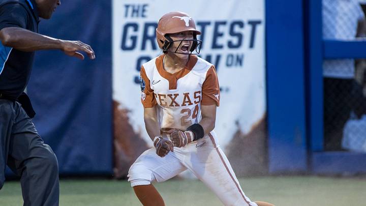 Texas Longhorns infielder Jaycie Nichols (24) reacts after called safe at home in the fourth inning against the Texas Tech Red Raiders.