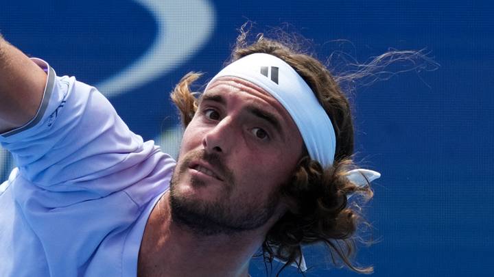 Stefanos Tsitsipas serves in a match