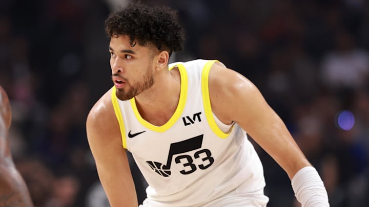 Apr 12, 2024; Los Angeles, California, USA; Utah Jazz guard Johnny Juzang (33) dribbles the ball against Los Angeles Clippers forward Paul George (13) during the first quarter at Crypto.com Arena. Mandatory Credit: Kiyoshi Mio-Imagn Images Apr 12, 2024; Los Angeles, California, USA; Utah Jazz guard Johnny Juzang (33) dribbles the ball against Los Angeles Clippers forward Paul George (13) during the first quarter at Crypto.com Arena. Mandatory Credit: Kiyoshi Mio-Imagn Images